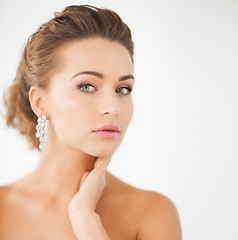 Image showing woman wearing shiny diamond earrings