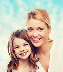 Image showing smiling mother and little girl