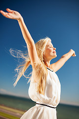 Image showing beautiful woman enjoying summer outdoors