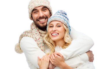 Image showing smiling couple in winter clothes hugging