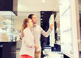 Image showing couple looking to shopping window at jewelry store