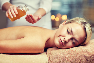 Image showing close up of woman lying on massage table in spa