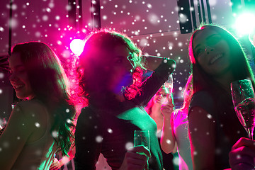 Image showing smiling friends with glasses of champagne in club