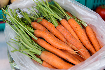 Image showing close up of carrot in plastic bag at street market