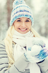 Image showing smiling young woman in winter forest