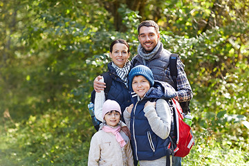 Image showing happy family with backpacks hiking