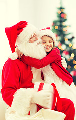 Image showing smiling little girl with santa claus