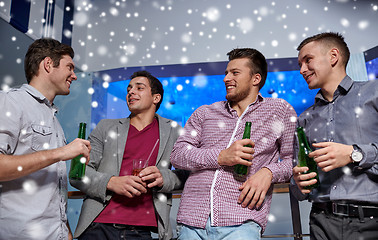 Image showing group of male friends with beer in nightclub