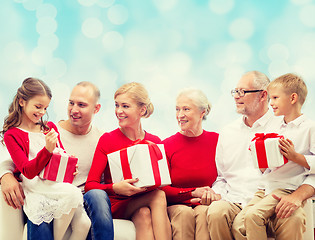 Image showing smiling family with gifts