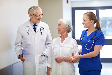 Image showing medics and senior patient woman at hospital