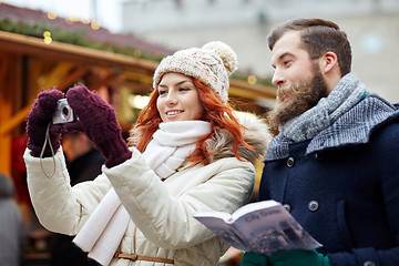 Image showing couple taking selfie with smartphone in old town