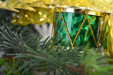 Image showing Christmas background with drums, green eve tree branch, golden new year decoration 