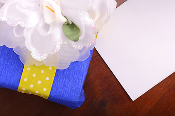 Image showing color gift boxes on wooden background