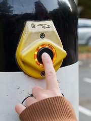 Image showing Hand pushing button for traffic light