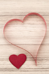 Image showing valentine\'s paper hearts on a wooden background