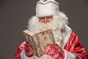 Image showing Santa Claus reading book