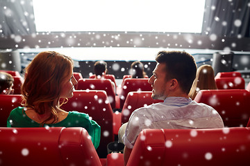 Image showing happy friends or couple watching movie in theater