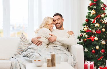 Image showing happy couple at home with christmas tree