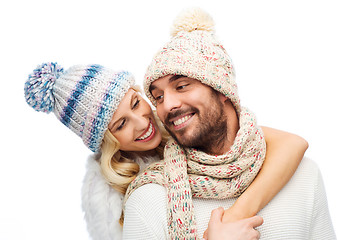 Image showing smiling couple in winter clothes hugging