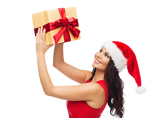 Image showing beautiful sexy woman in santa hat with gift box