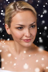 Image showing close up of young woman in bath towel at sauna