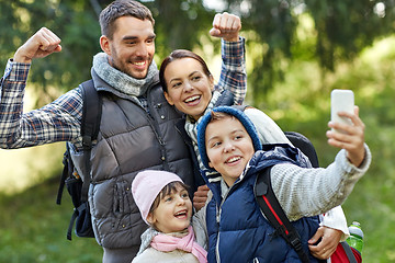 Image showing family taking selfie with smartphone in woods