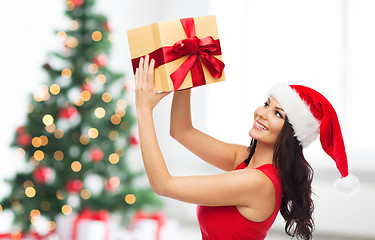 Image showing beautiful sexy woman in santa hat with gift box