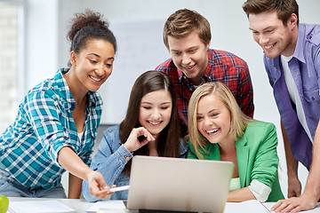 Image showing group of happy high school students with laptop