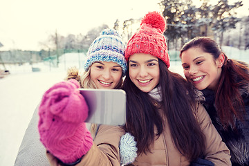 Image showing happy teenage girls taking selfie with smartphone