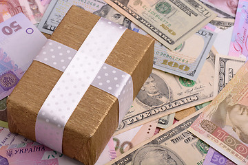 Image showing american money and golden gift box, european money
