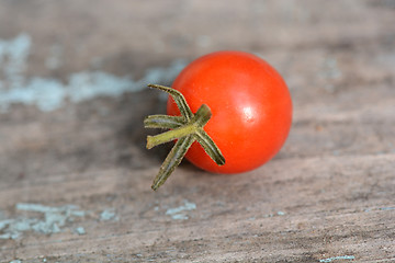 Image showing red cherry tomatoes on a old wood background