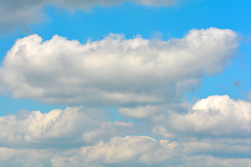 Image showing white fluffy clouds in the blue sky