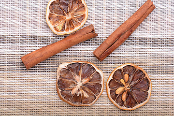 Image showing Slices of fresh dried lemon, orange and spices for cooking or baking