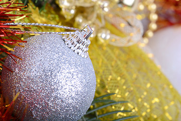 Image showing Closeup of Christmas balls and green fir tree branch, new year invitation card
