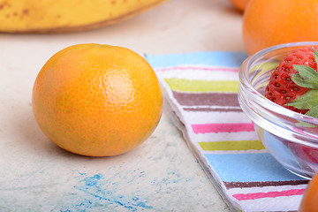 Image showing Fresh organic fruits ( strawberry, banana, mandarin, orange)