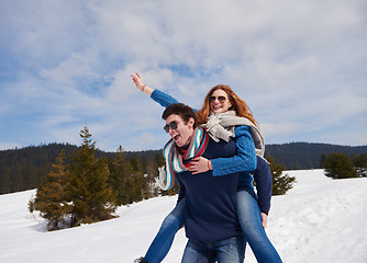 Image showing happy young couple having fun on fresh show on winter vacation