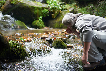 Image showing man drinking fresh water from spring