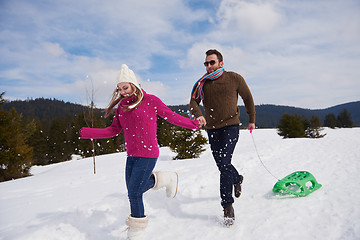 Image showing happy young couple having fun on fresh show on winter vacation