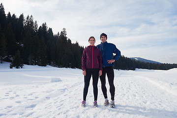 Image showing couple jogging outside on snow