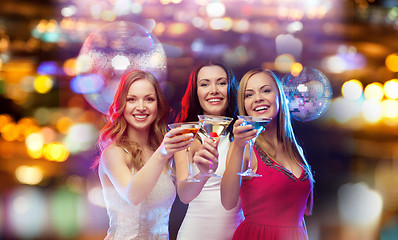 Image showing smiling women with cocktails at night club