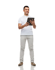 Image showing smiling man with tablet pc computer