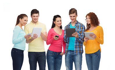 Image showing group of teenagers with smartphones and tablet pc