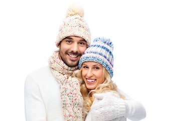 Image showing smiling couple in winter clothes hugging