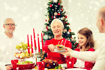 Image showing smiling family having holiday dinner at home