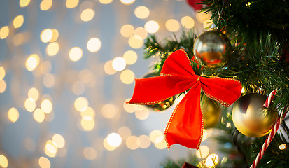 Image showing close up of red bow decoration on christmas tree