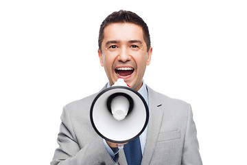 Image showing happy businessman in suit speaking to megaphone