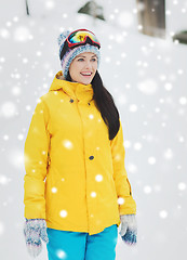 Image showing happy young woman in ski goggles outdoors