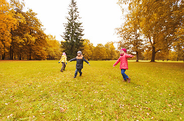 Image showing happy little children running and playing outdoors