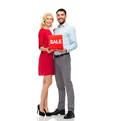 Image showing happy couple with red sale sign