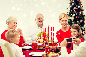 Image showing smiling family having holiday dinner at home